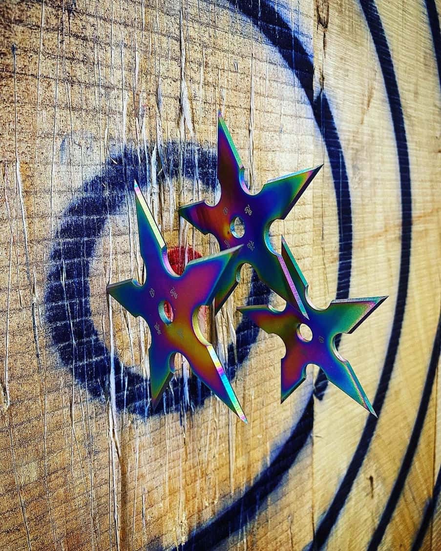 Colorful shurikens stuck in the target